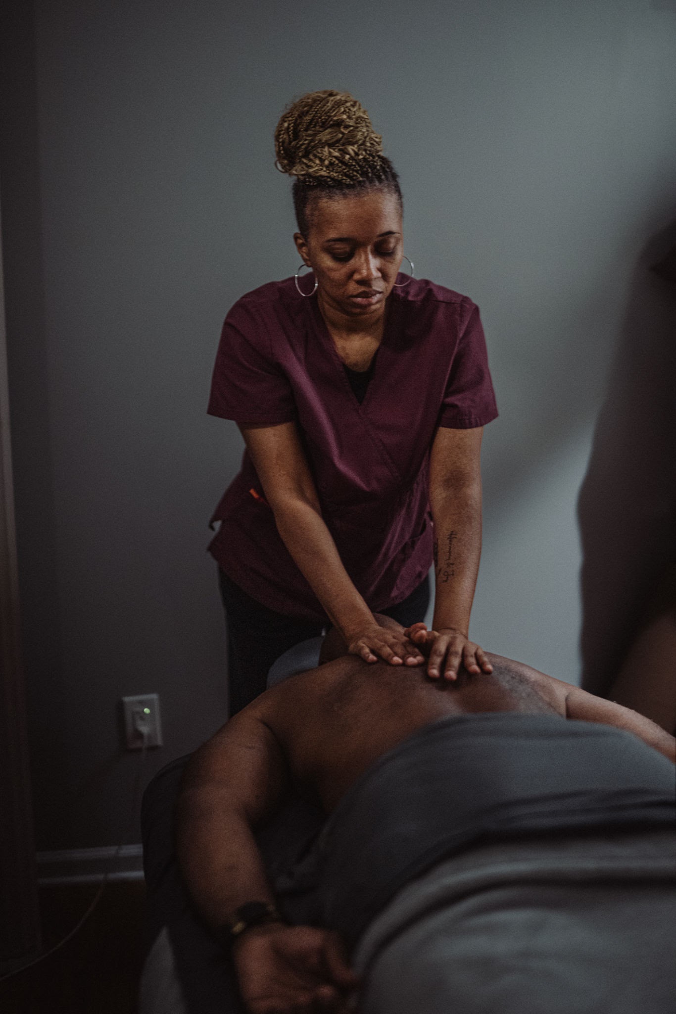 Massage therapist providing treatment